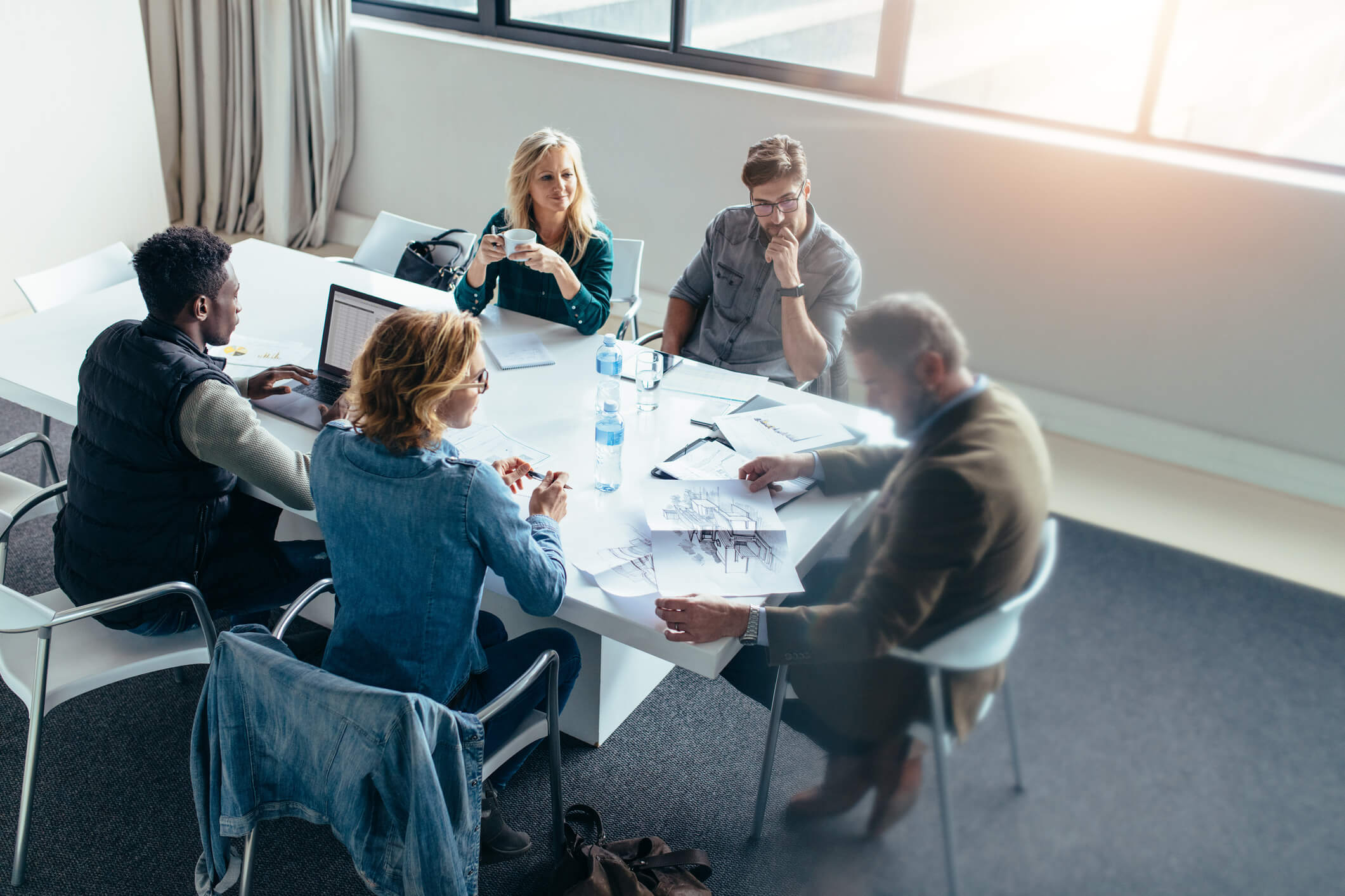 Boston businesspeople sitting around a table