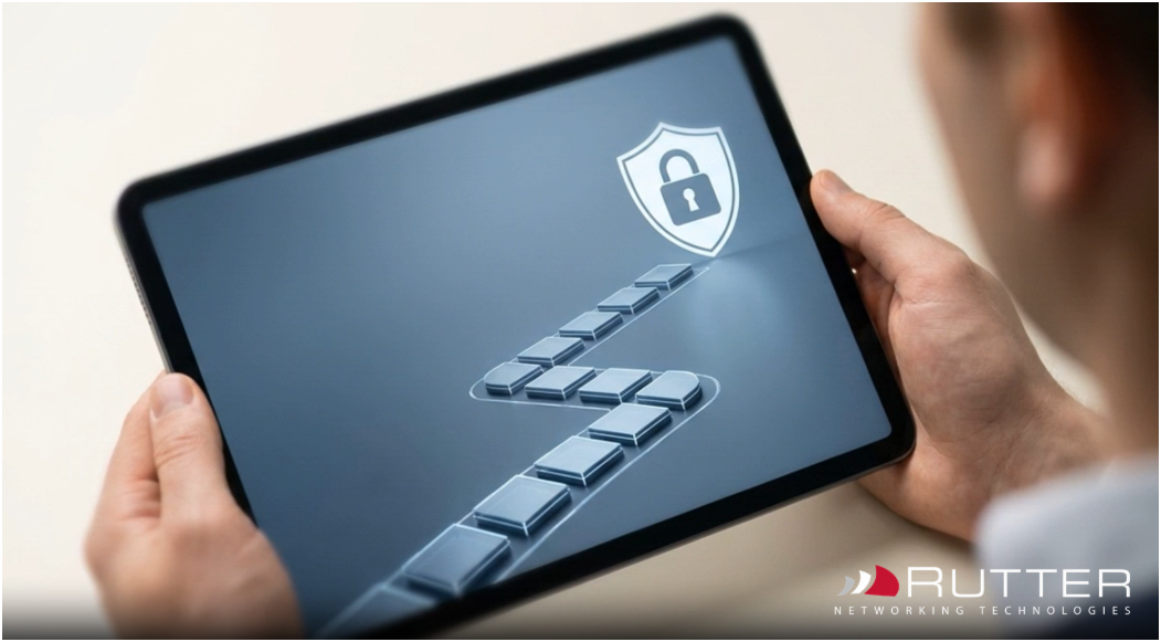Rutter cybersecurity image showing a secure digital access pathway on a tablet with a shield and lock icon for protected IT access and infrastructure security. Rutter cybersecurity image showing a secure digital access pathway on a tablet with a shield and lock icon for protected IT access and infrastructure security.